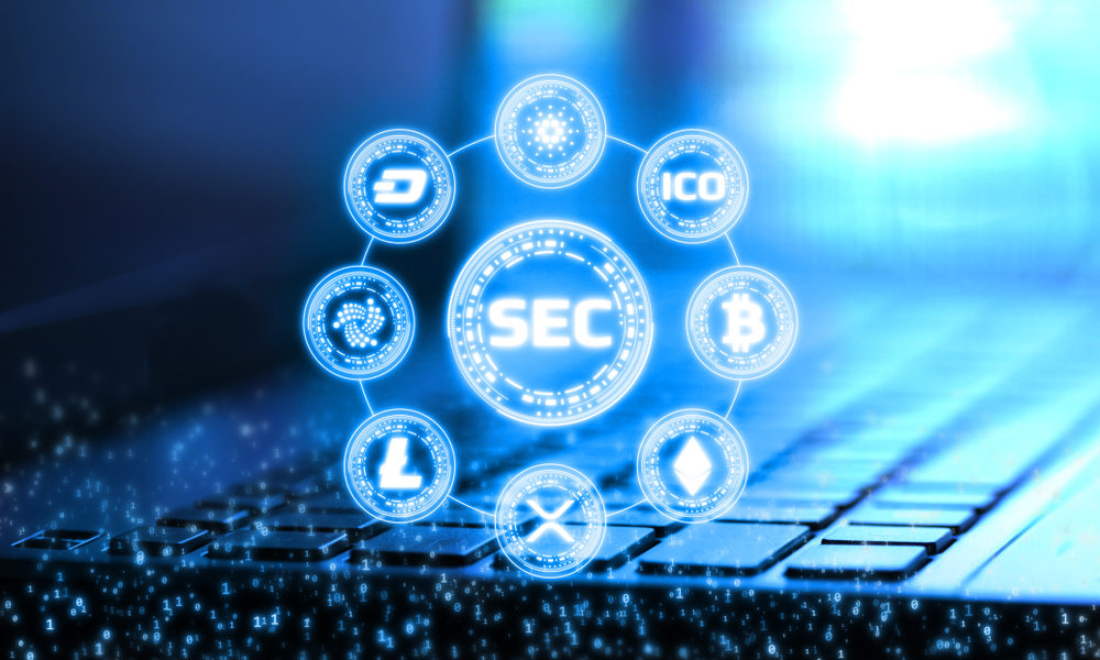 A digital illustration of the SEC logo at the center, surrounded by cryptocurrency icons such as Bitcoin, Ethereum, and Litecoin, overlaid on a blurred laptop keyboard background with a blue glowing effect.